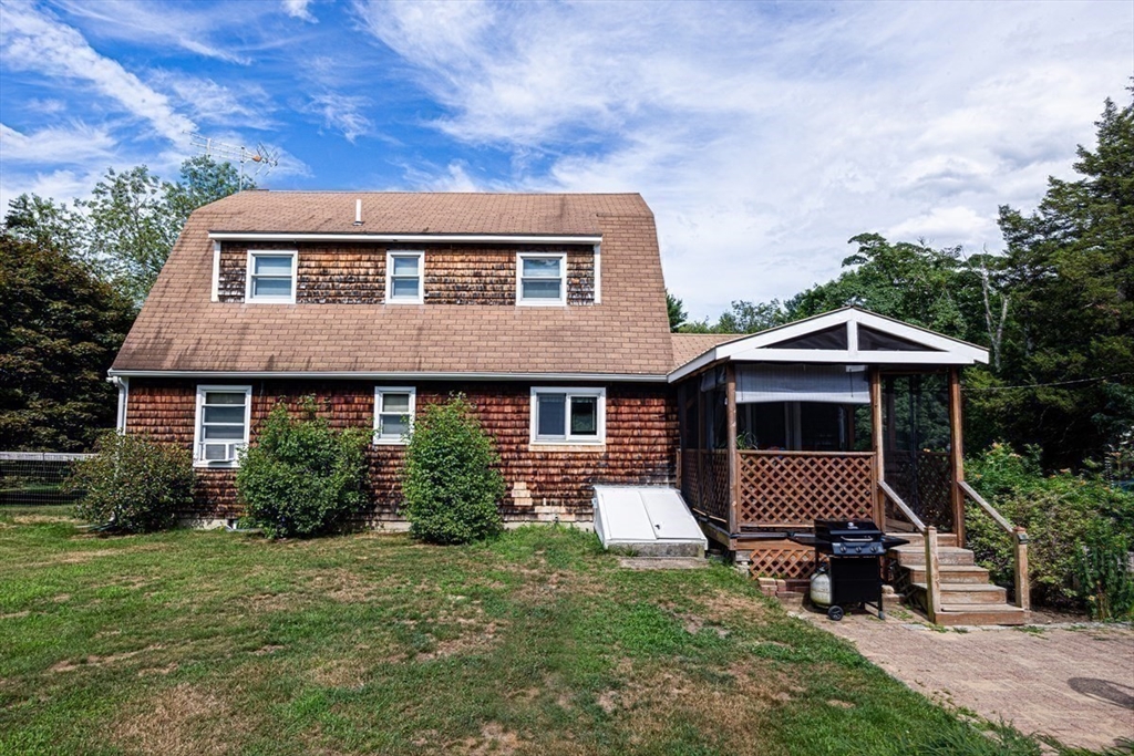 421 County Road Rochester, MA 02576 - Photo 23 of 42 a front view of a house with garden
