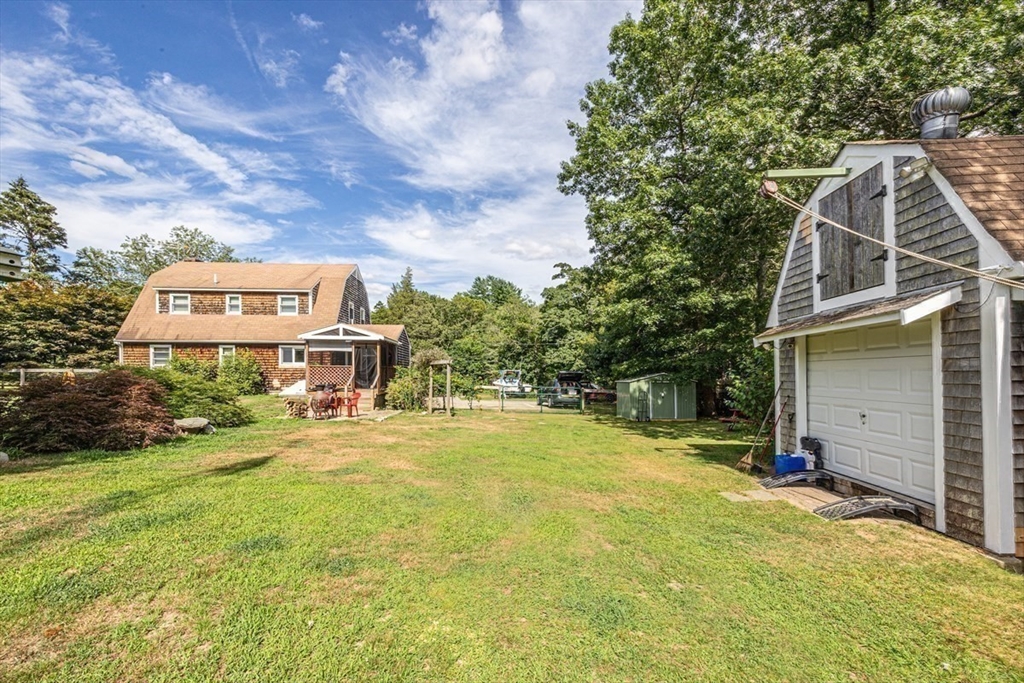 421 County Road Rochester, MA 02576 - Photo 25 of 42 a view of a house with a yard and sitting area