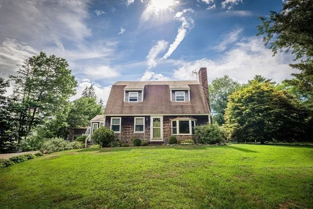 a front view of a house with a yard