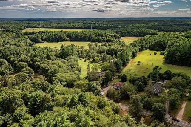 a view of a garden with an ocean view