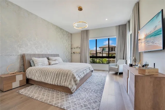 a bedroom with a large bed and a view of bedroom