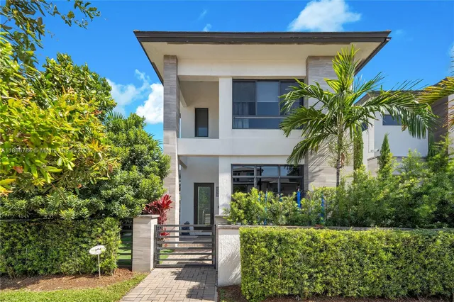 a house with a tree in front of it