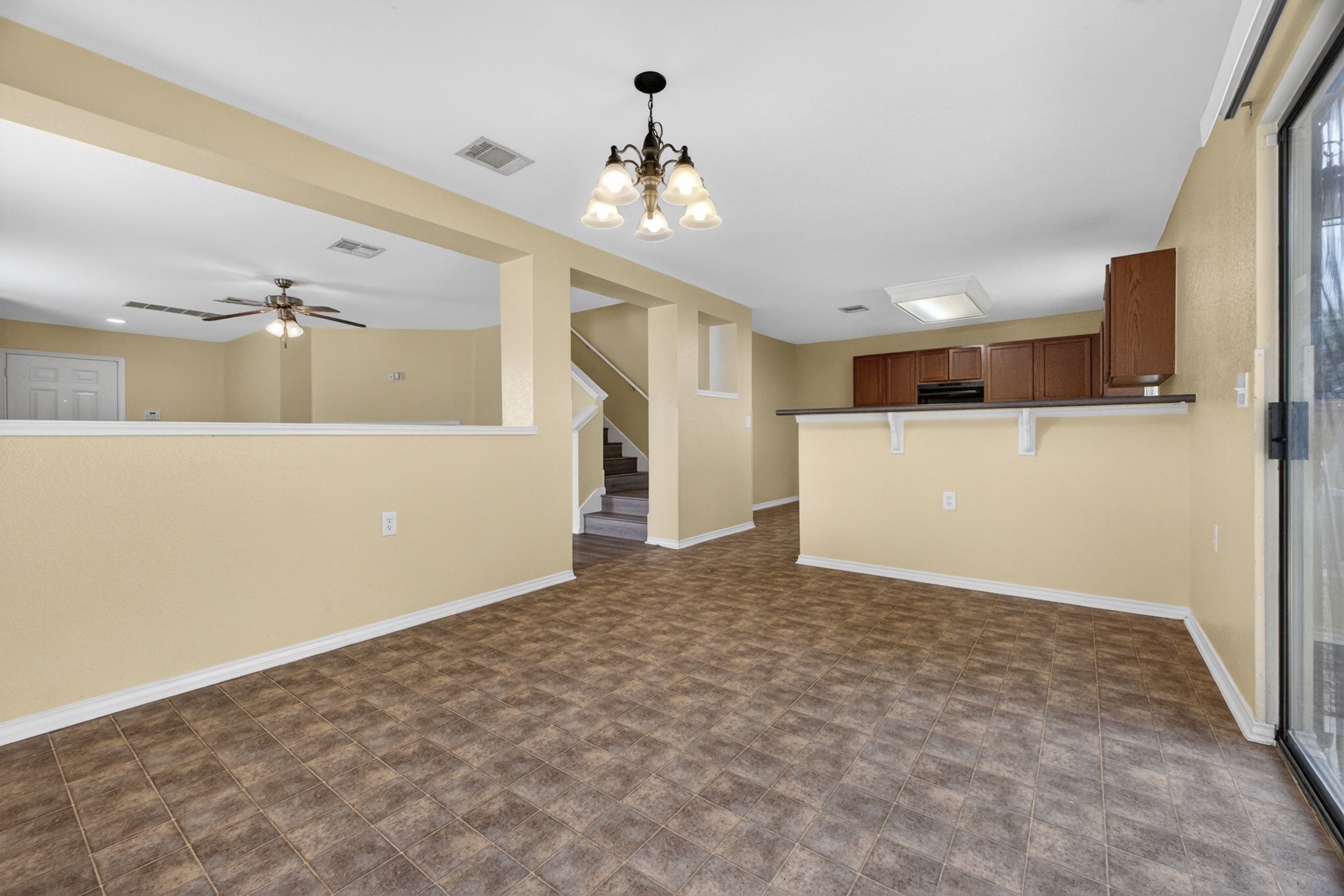 8813 Wiley Way Austin, TX 78747 - Photo 7 of 39 View of the kitchen and breakfast bar from the dining area