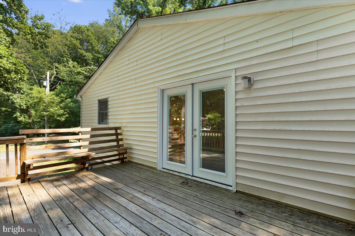 869 Plains Road Lusby, MD 20657 - Photo 32 of 35 deck off of kitchen