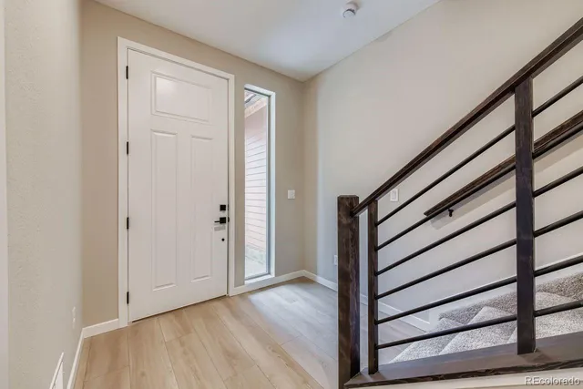 a view of entryway with wooden floor