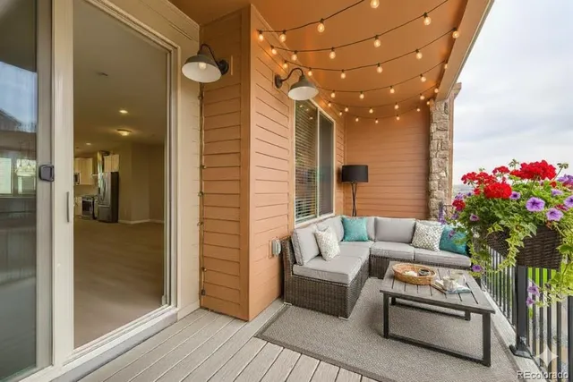 a outdoor living space with furniture and a potted plant