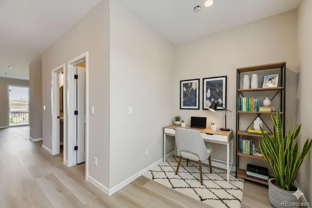 a work room with furniture and a bookshelf