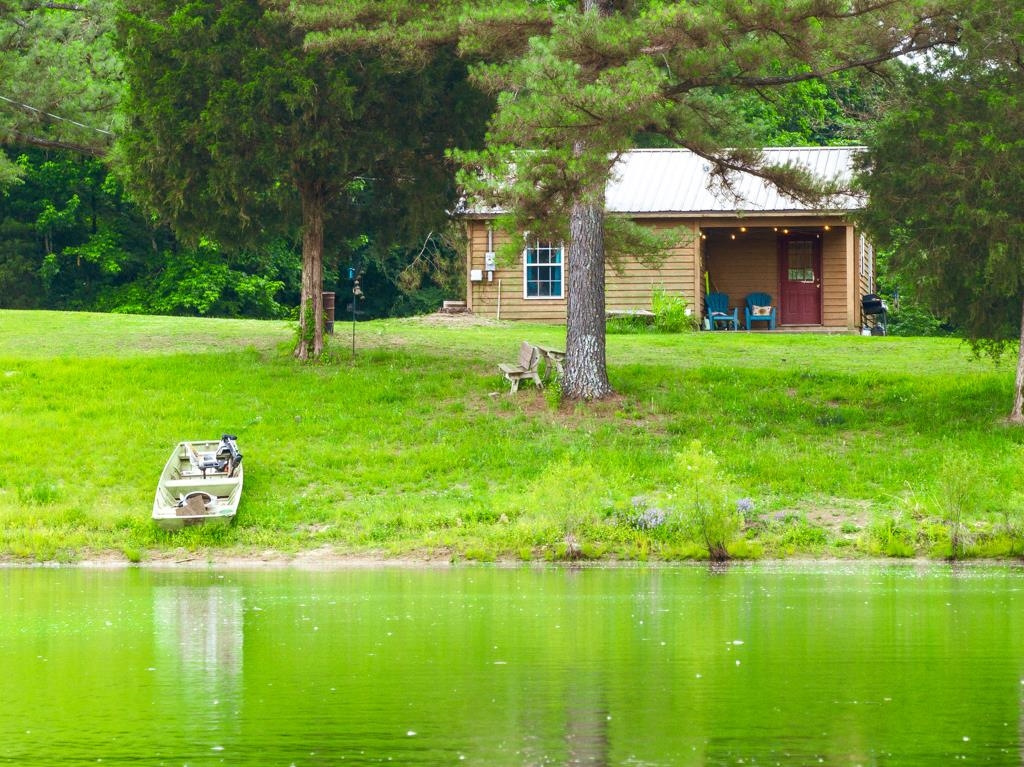0 Poplar Grove Cemetery Road Henning, TN 38041 - Photo 6 of 40 Waterfront property featuring a wood-sided cabin with a covered porch