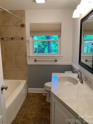 a bathroom with a sink and a bathtub