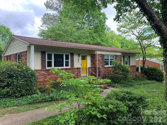 a view of an house with backyard space and garden