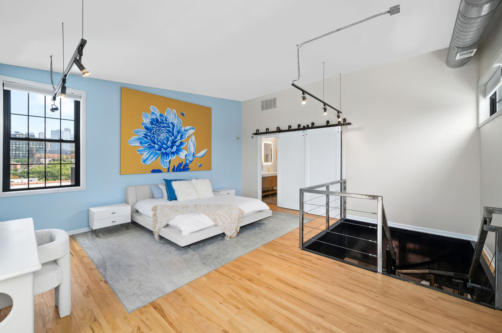 17 North Loomis Street, Unit 4D Chicago, IL 60607 - Photo 11 of 26 a bedroom with furniture and a wooden floor