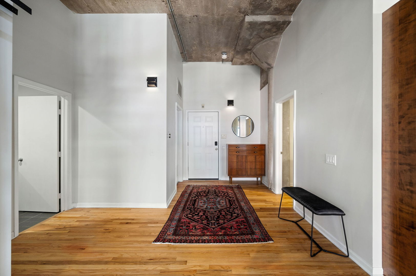 17 North Loomis Street, Unit 4D Chicago, IL 60607 - Photo 19 of 26 a view of a hallway with wooden floor and front door