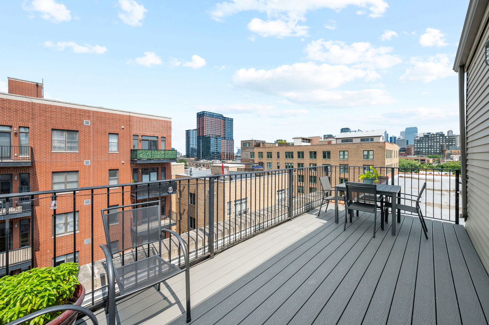 17 North Loomis Street, Unit 4D Chicago, IL 60607 - Photo 20 of 26 a view of a balcony with wooden floor