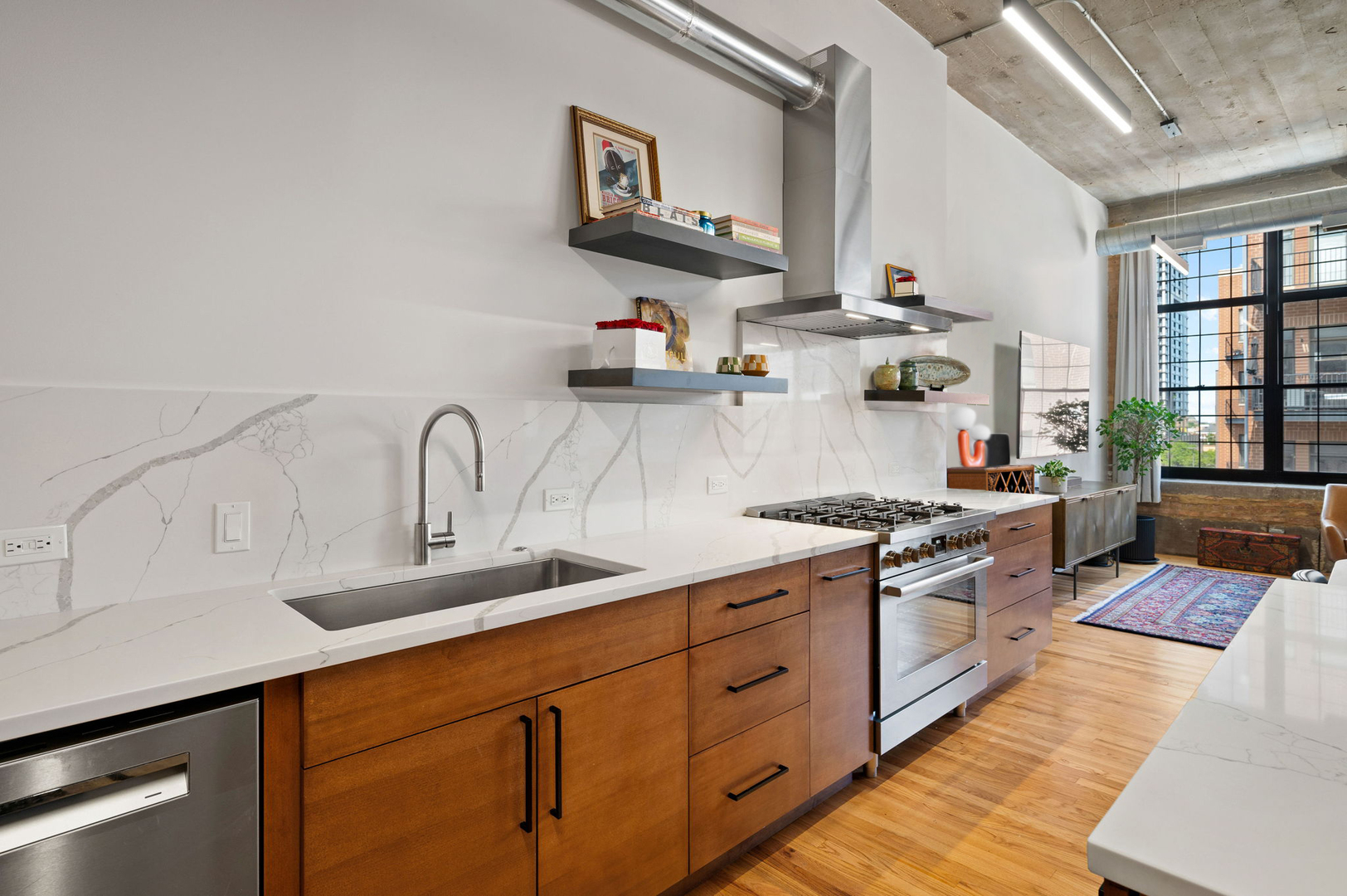 17 North Loomis Street, Unit 4D Chicago, IL 60607 - Photo 5 of 26 a kitchen with cabinets a sink and appliances