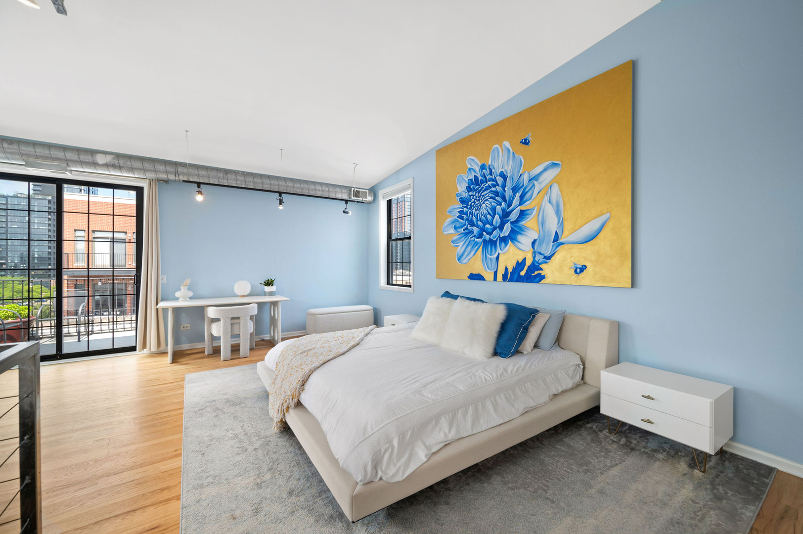 17 North Loomis Street, Unit 4D Chicago, IL 60607 - Photo 9 of 26 a bedroom with a bed and a painting on the wall