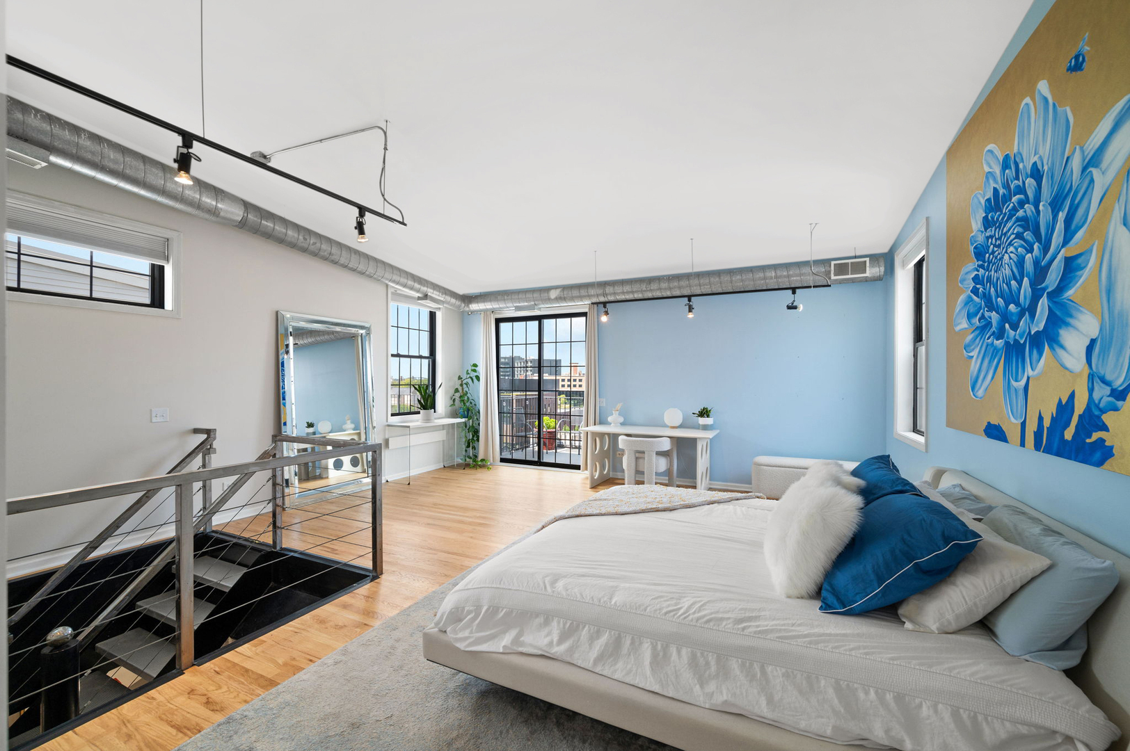 17 North Loomis Street, Unit 4D Chicago, IL 60607 - Photo 10 of 26 a large bedroom with a bed and furniture