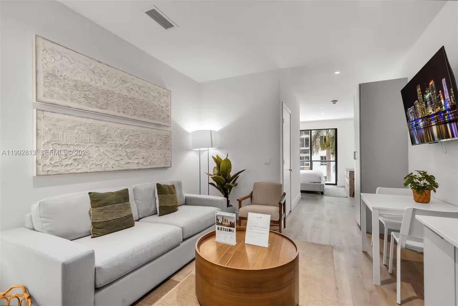 a living room with furniture and a table