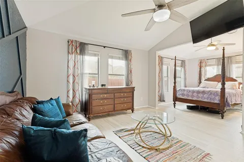 a bedroom with a bed next to a window with outer view