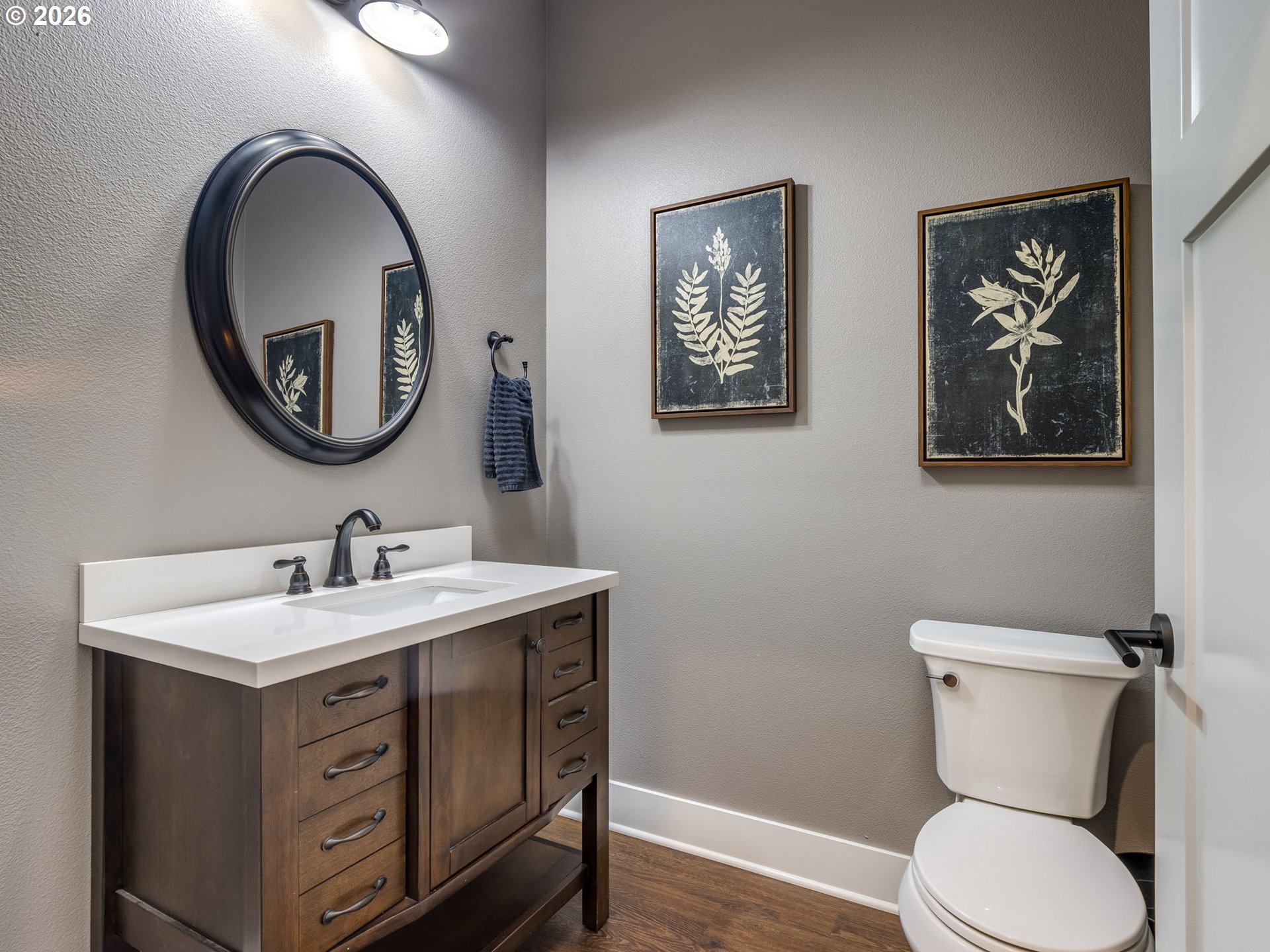12950 South Barnards Road Molalla, OR 97038 - Photo 20 of 48 a bathroom with a toilet a sink and a mirror