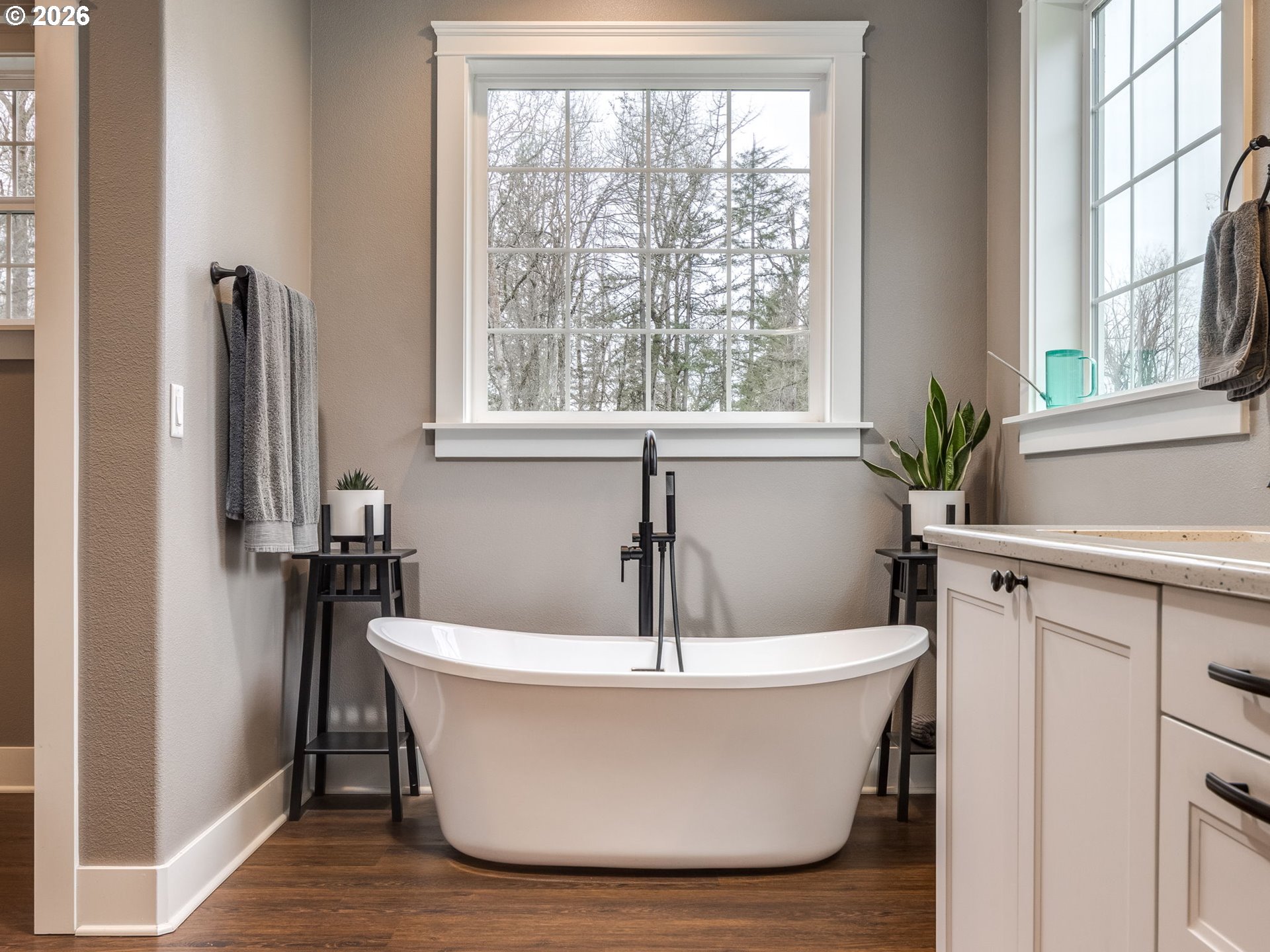 12950 South Barnards Road Molalla, OR 97038 - Photo 29 of 48 a white bath tub sitting in a bathroom next to a window