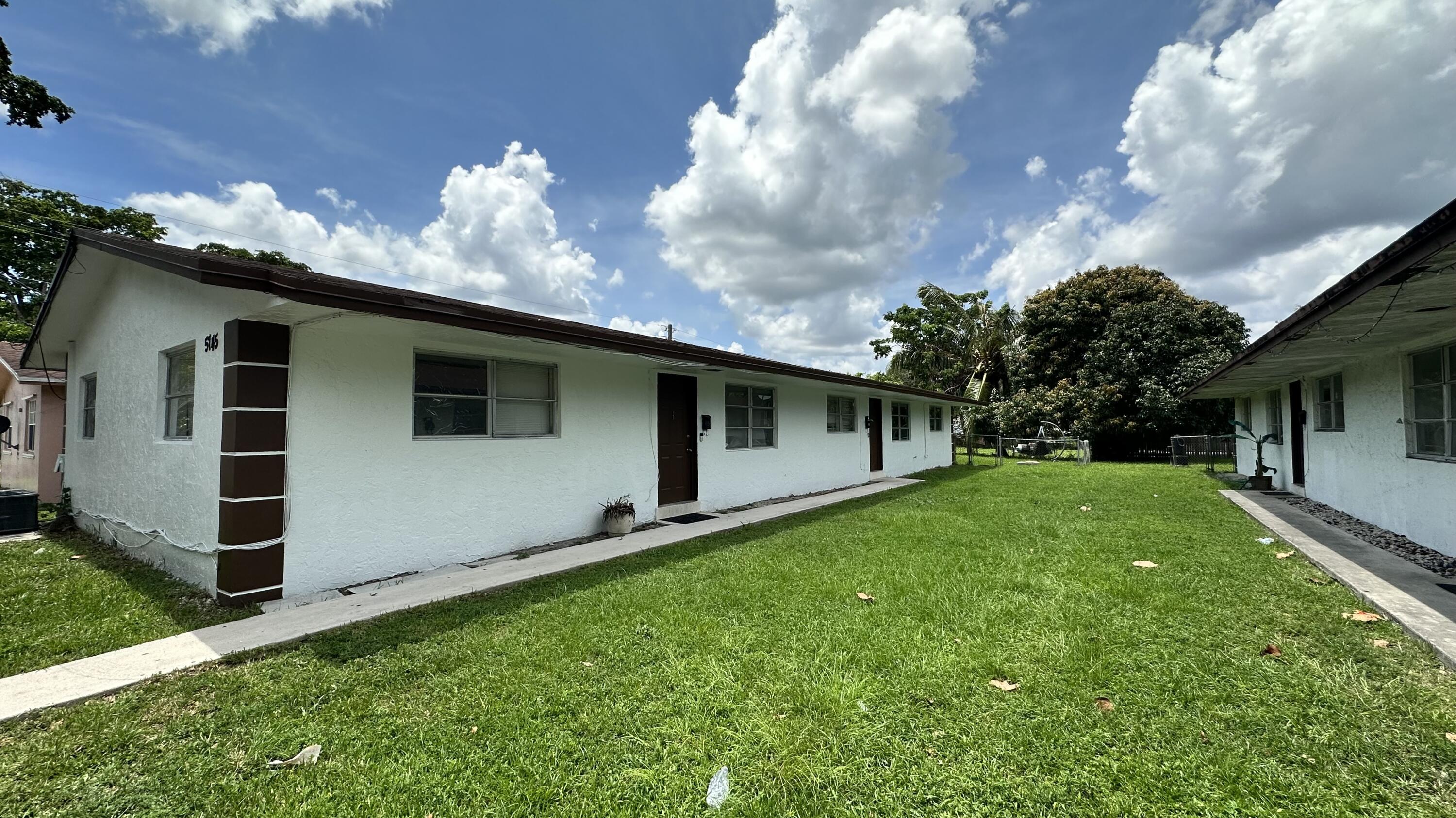 a backyard of a house with lots of green space