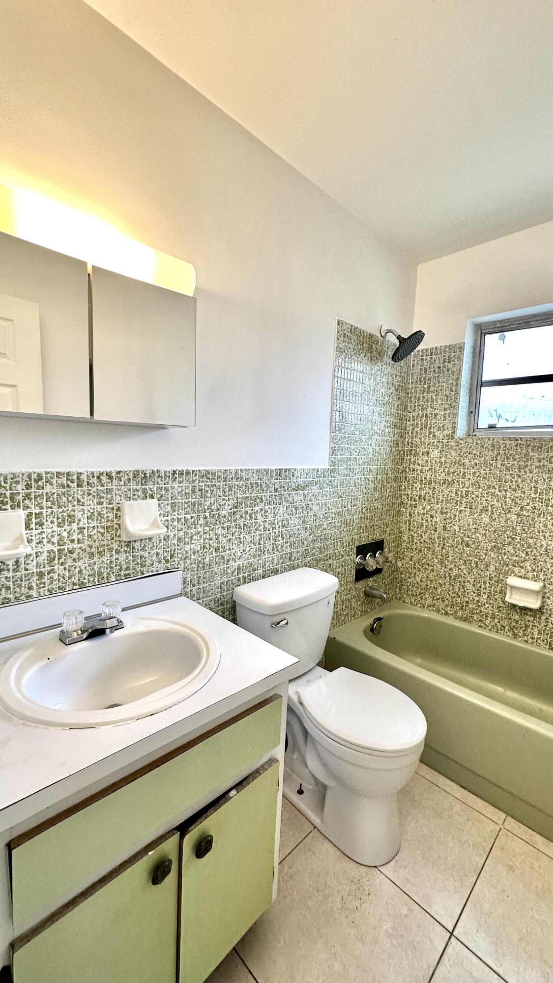 5745 Buchanan Street Hollywood, FL 33021 - Photo 11 of 20 a bathroom with a sink a toilet and bathtub