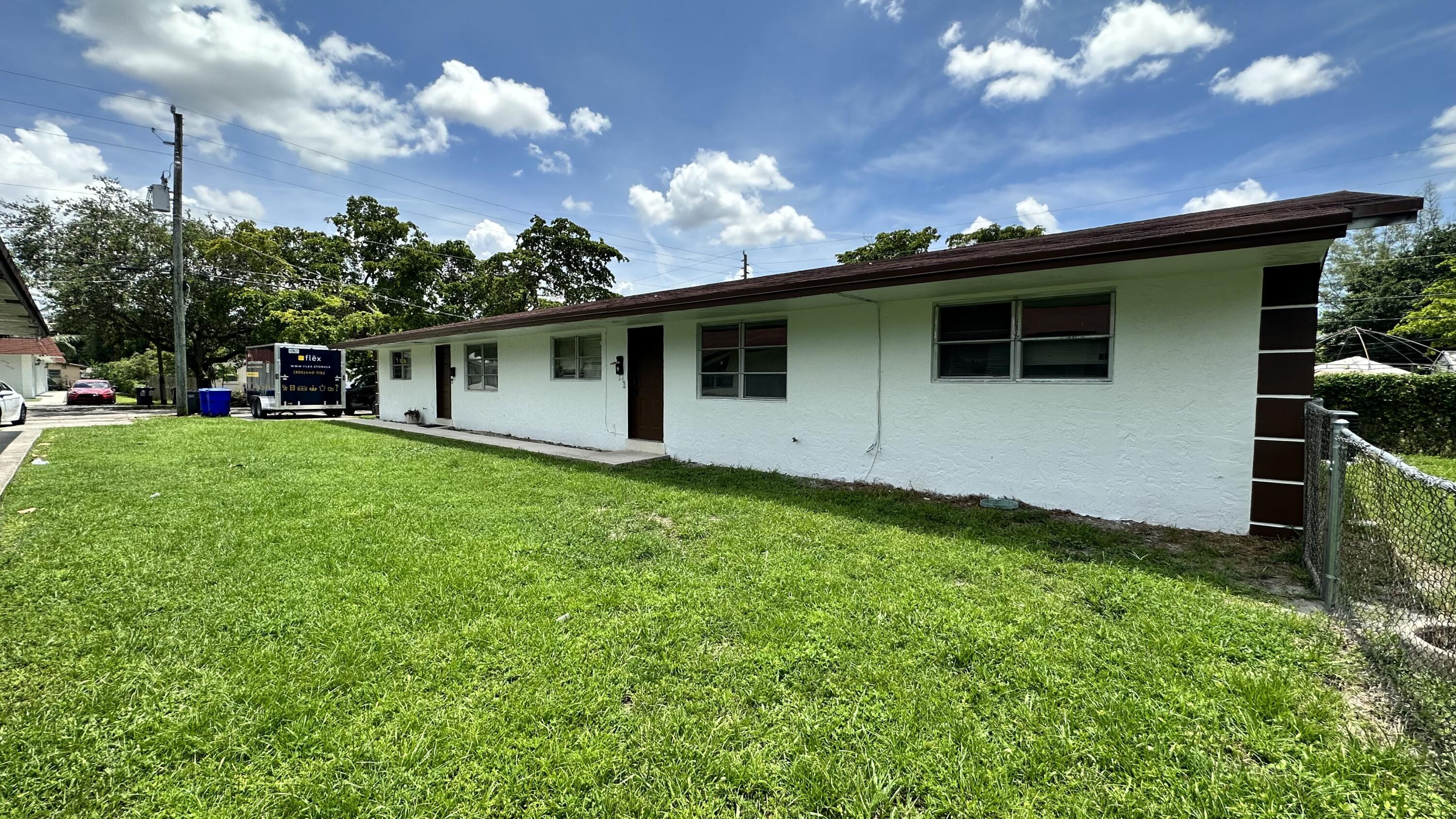 5745 Buchanan Street Hollywood, FL 33021 - Photo 14 of 20 a view of a house with backyard and garden