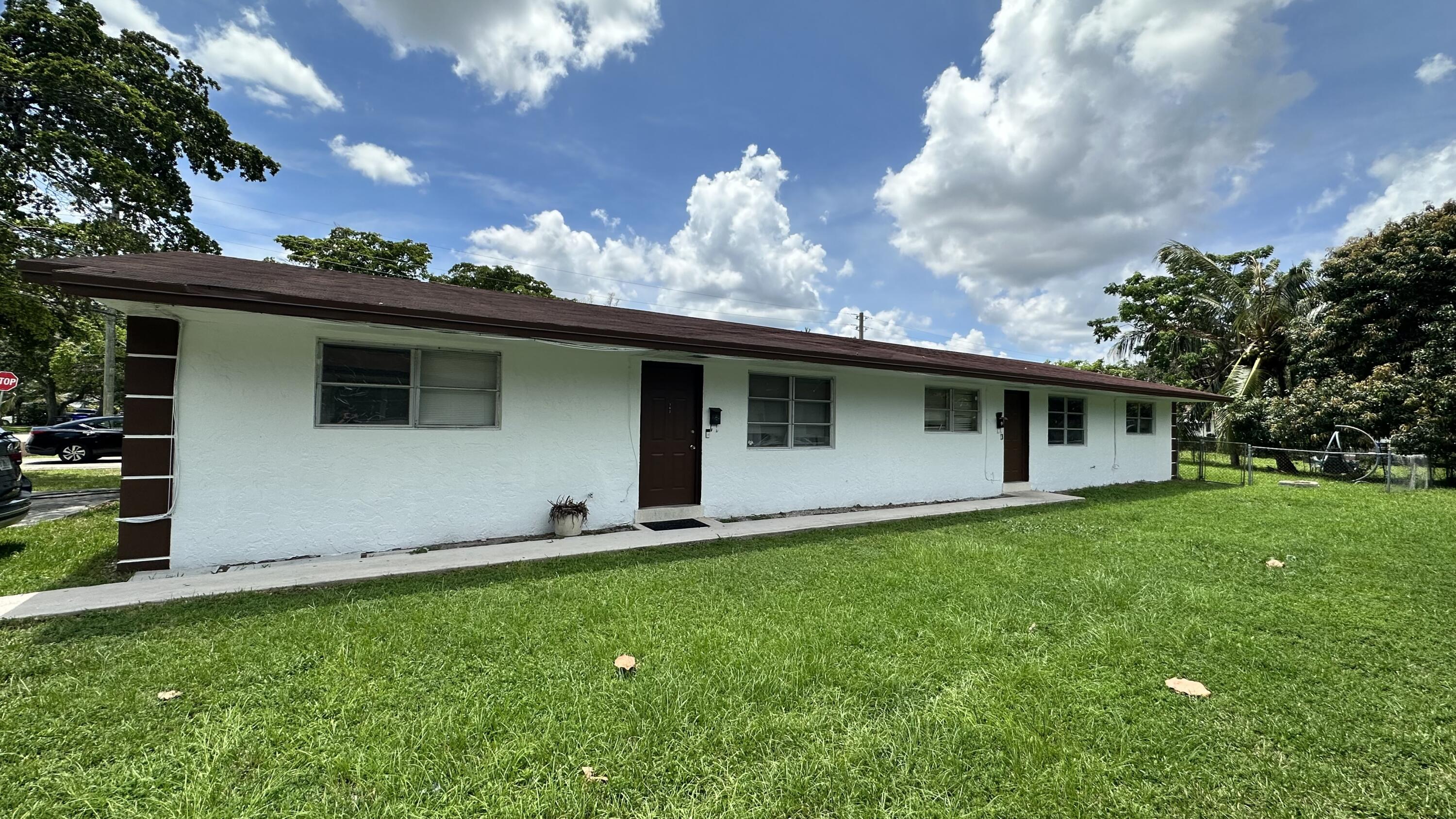 5745 Buchanan Street Hollywood, FL 33021 - Photo 20 of 20 a backyard of a house with table and chairs