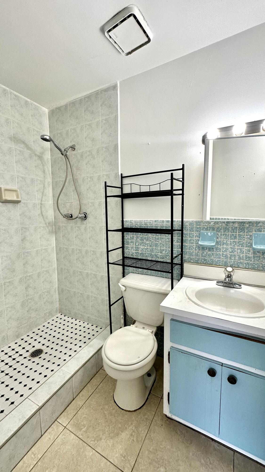 5745 Buchanan Street Hollywood, FL 33021 - Photo 7 of 20 a bathroom with a sink toilet and shower