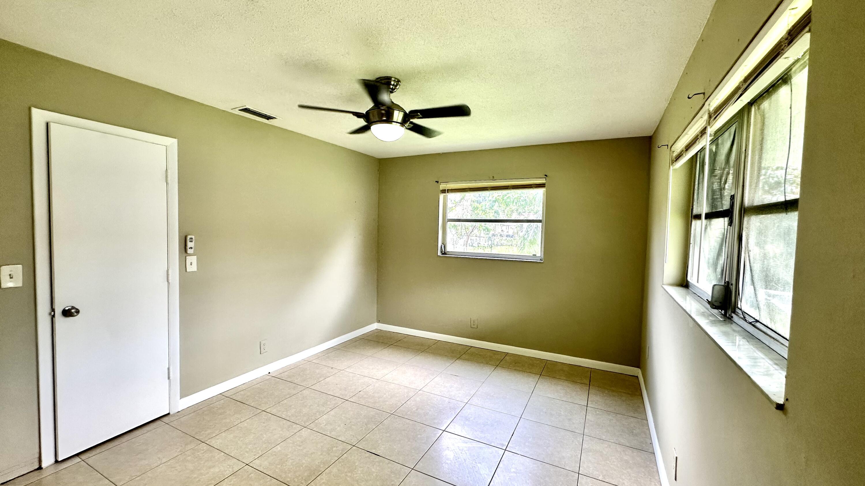 5745 Buchanan Street Hollywood, FL 33021 - Photo 9 of 20 a view of an empty room with a window