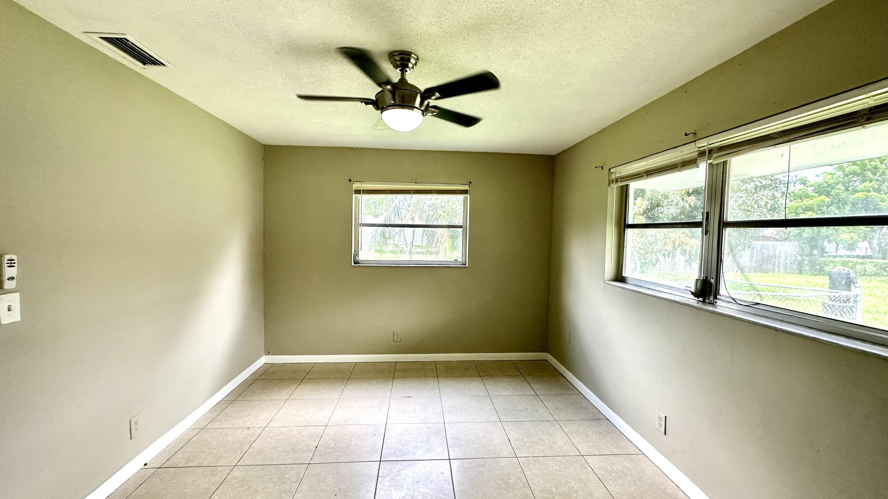 5745 Buchanan Street Hollywood, FL 33021 - Photo 10 of 20 a view of an empty room with a window