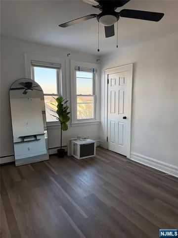 a view of a livingroom with furniture and a window