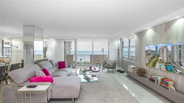 a living room with furniture and a large window