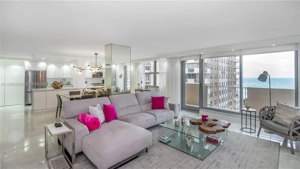 a living room with furniture and a large window