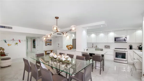 a view of a a dining room with furniture window and wooden floor