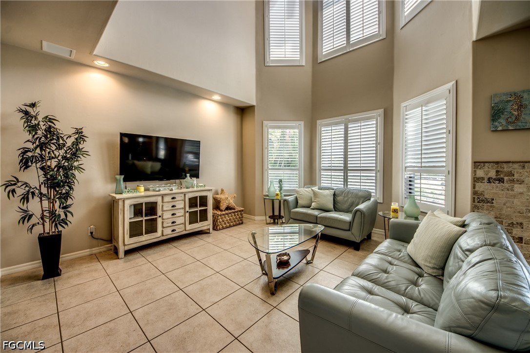 5601 Del Rio Court Cape Coral, FL 33904 - Photo 11 of 50 a living room with furniture and a flat screen tv