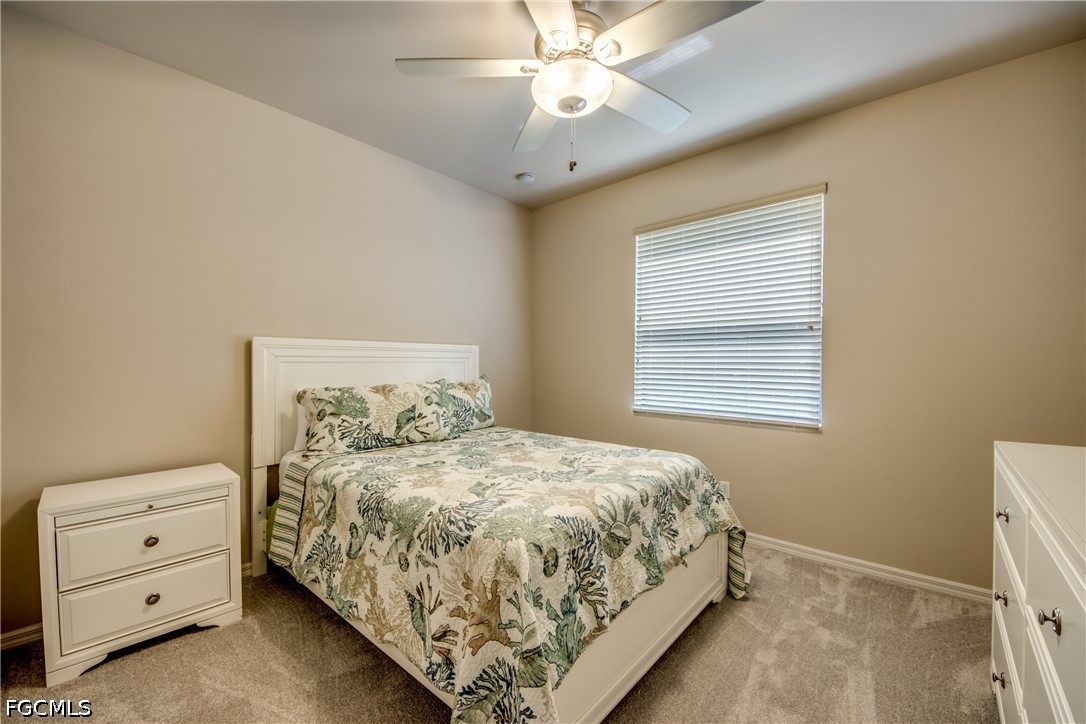 5601 Del Rio Court Cape Coral, FL 33904 - Photo 21 of 50 a bedroom with a bed and a window
