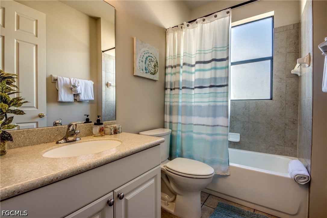 5601 Del Rio Court Cape Coral, FL 33904 - Photo 22 of 50 a bathroom with a sink a toilet and shower