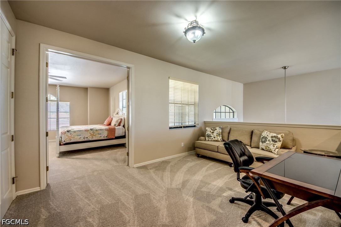 5601 Del Rio Court Cape Coral, FL 33904 - Photo 25 of 50 a view of a livingroom with furniture and a ceiling fan