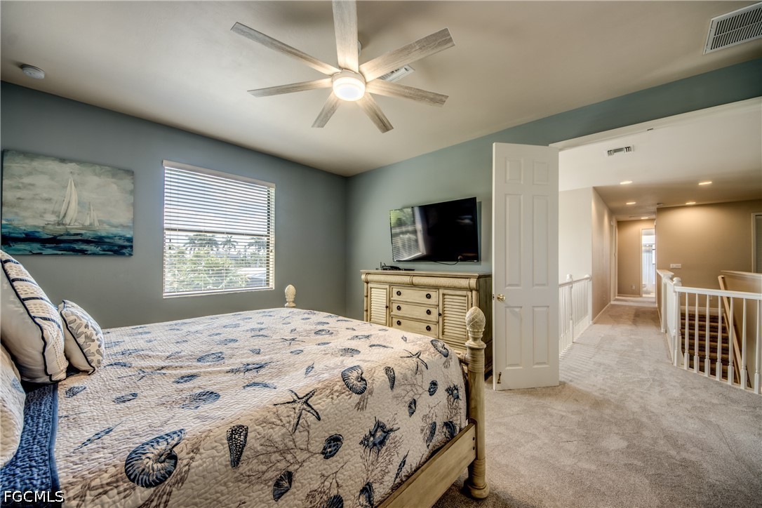 5601 Del Rio Court Cape Coral, FL 33904 - Photo 28 of 50 a bedroom with a bed and a flat screen tv