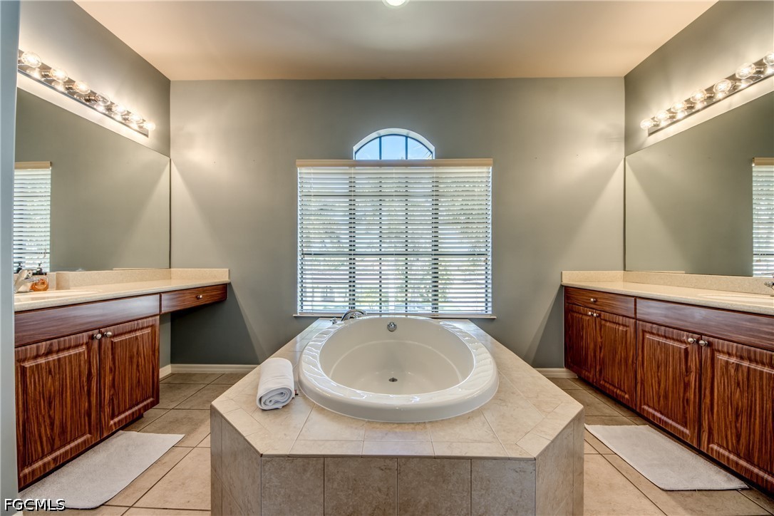 5601 Del Rio Court Cape Coral, FL 33904 - Photo 31 of 50 a bathroom with a sink and a mirror