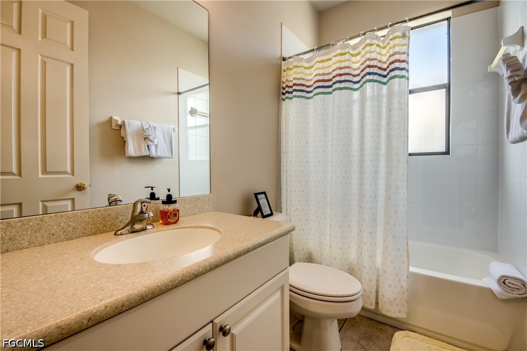 5601 Del Rio Court Cape Coral, FL 33904 - Photo 35 of 50 a bathroom with a sink toilet and shower