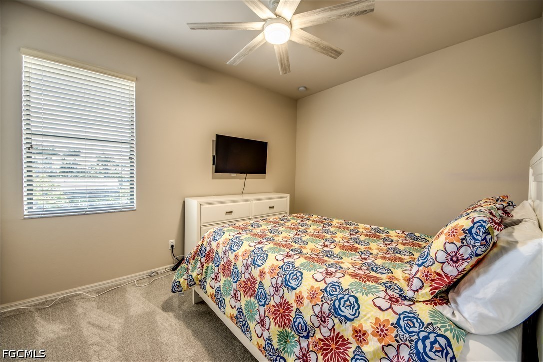 5601 Del Rio Court Cape Coral, FL 33904 - Photo 36 of 50 a bedroom with a bed and a flat screen tv