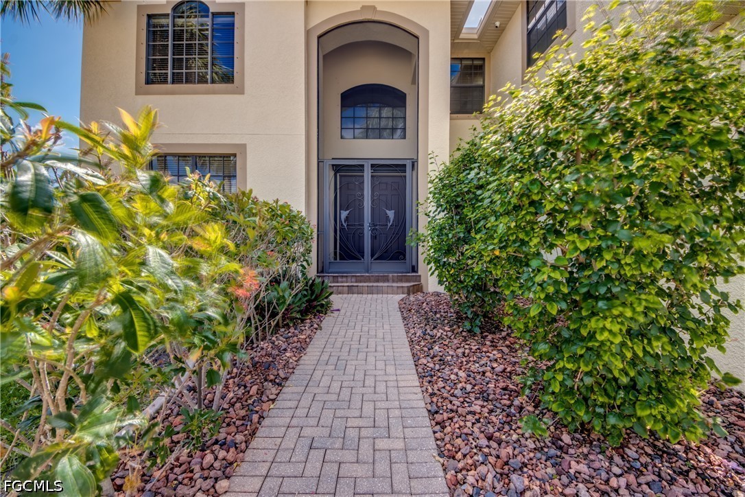 5601 Del Rio Court Cape Coral, FL 33904 - Photo 4 of 50 front view of a house with a yard