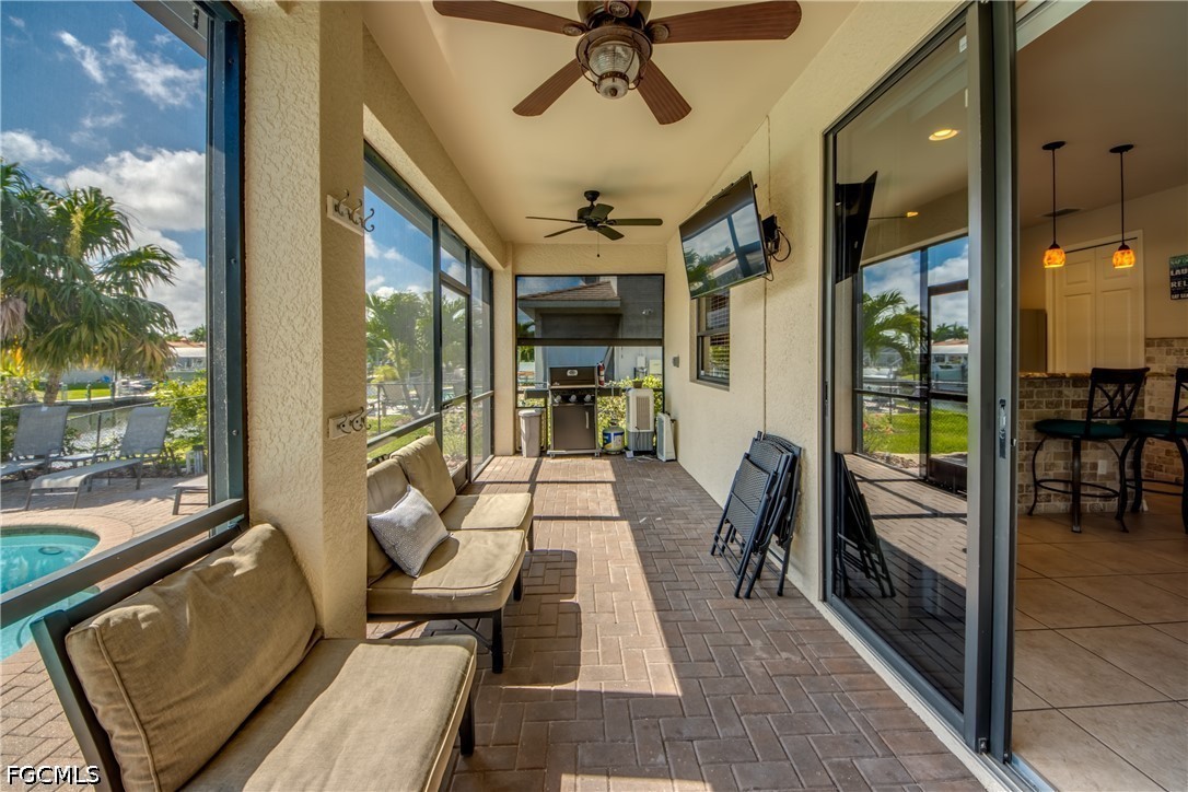 5601 Del Rio Court Cape Coral, FL 33904 - Photo 42 of 50 a view of a porch with furniture