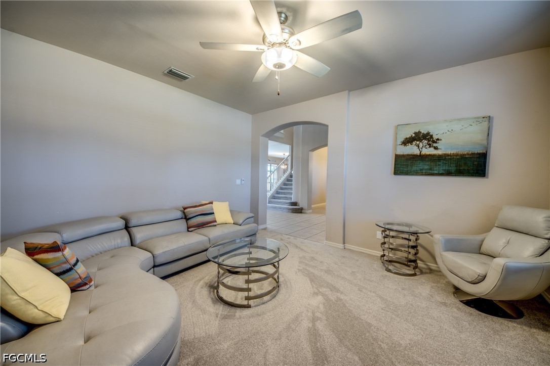 5601 Del Rio Court Cape Coral, FL 33904 - Photo 8 of 50 a living room with furniture and a chandelier