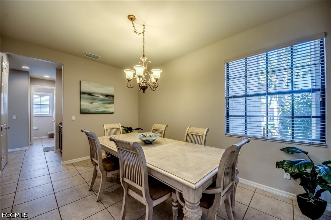 5601 Del Rio Court Cape Coral, FL 33904 - Photo 9 of 50 a view of a dining room with furniture window and outside view