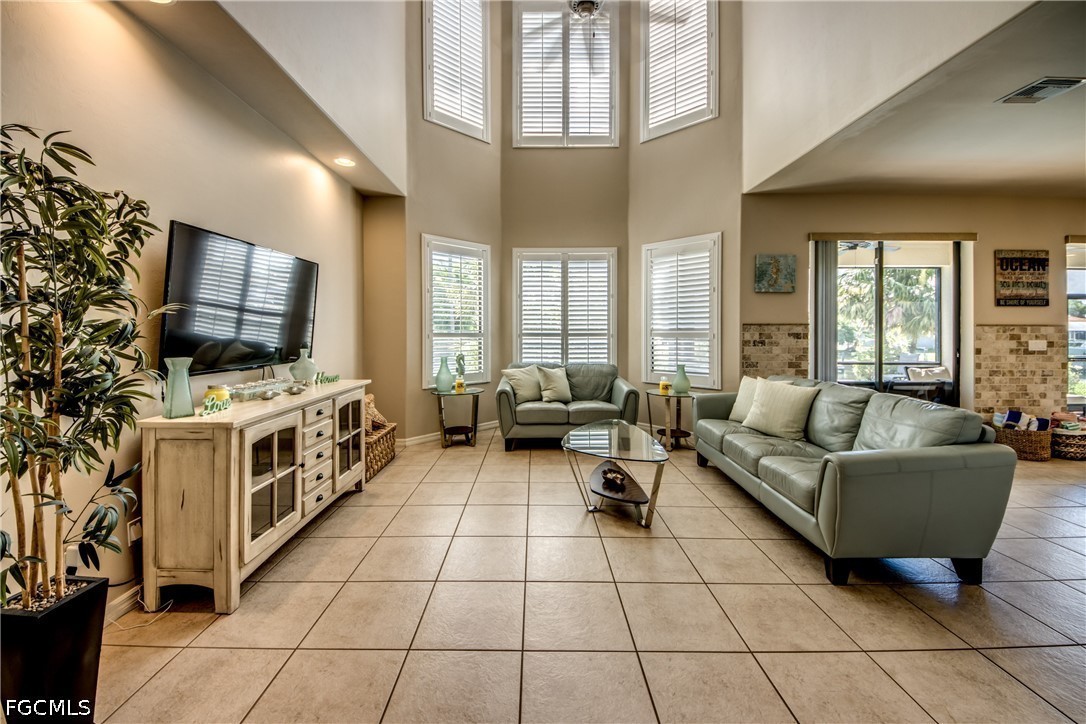 5601 Del Rio Court Cape Coral, FL 33904 - Photo 10 of 50 a living room with furniture and a flat screen tv