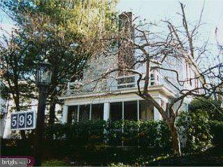 593 Hansell Road Wynnewood, PA 19096 - Photo 2 of 4 a view of a white house with a tree in front of it