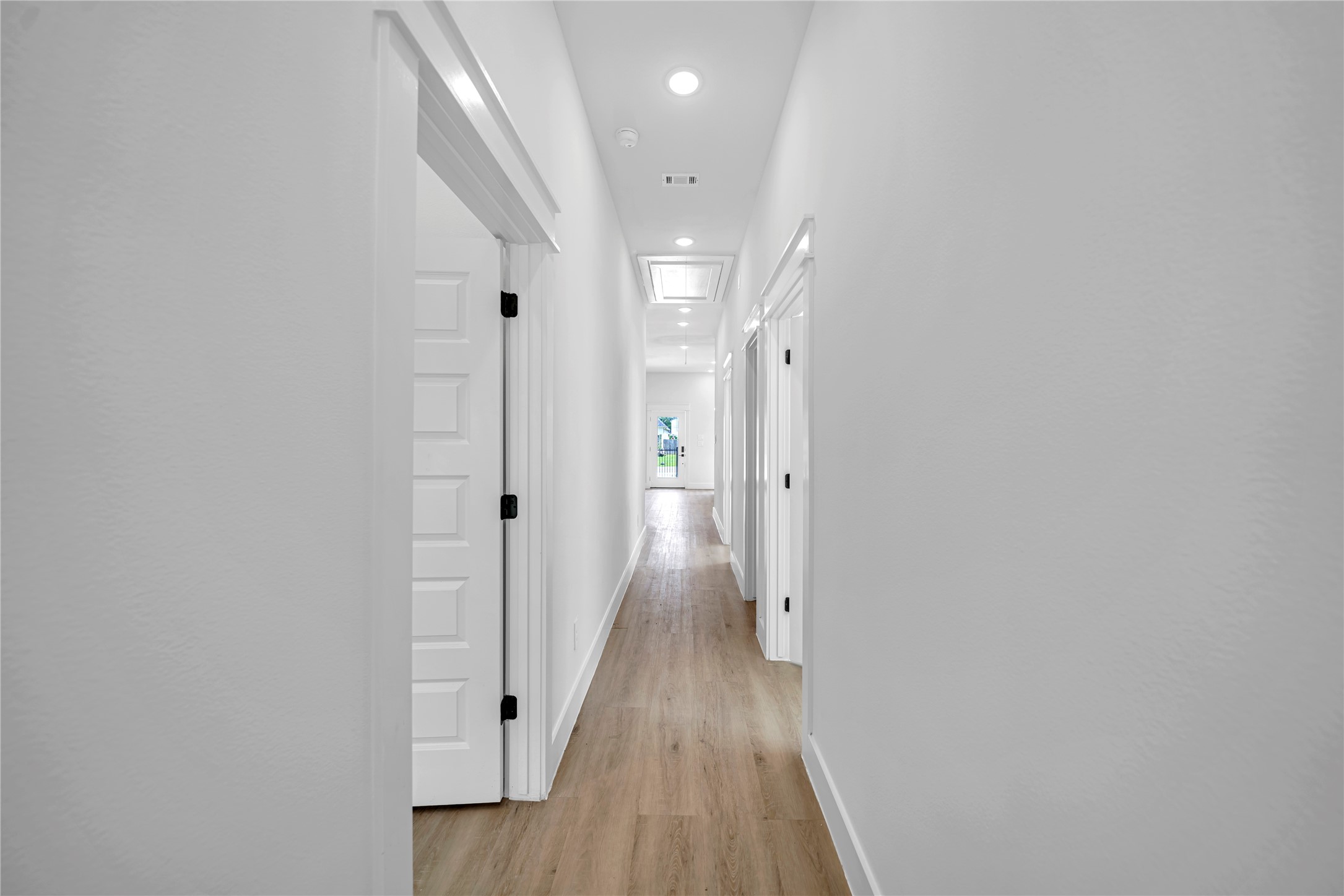 4902 Higgins Street, Unit A Houston, TX 77033 - Photo 8 of 25 a view of a hallway with wooden floor